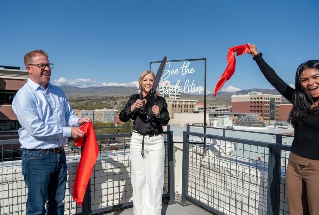 Ribbon cutting ceremony at a new apartment community rooftop